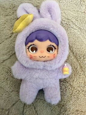 Nommi plush figure charm Loveliness Never Ends Series, specifically the "Tutu"